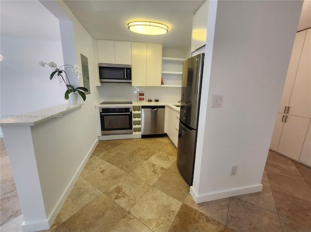 kitchen featuring stainless steel appliances, tasteful backsplash, baseboards, open shelves, and light countertops