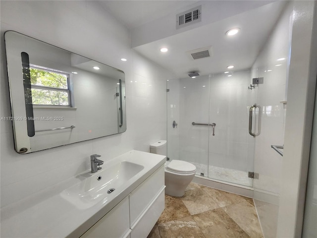 full bathroom with toilet, visible vents, recessed lighting, a shower stall, and vanity