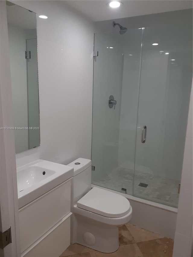 full bath featuring vanity, tile patterned flooring, a shower stall, and toilet