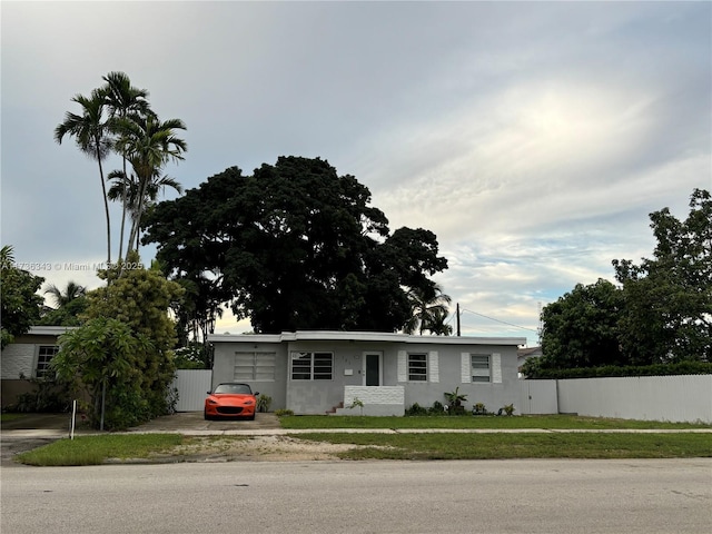 ranch-style house with a front lawn