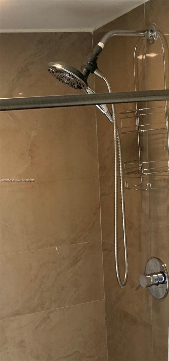 interior space with a tile shower