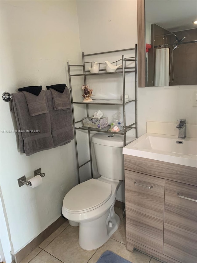 bathroom with a shower with curtain, tile patterned floors, toilet, and vanity