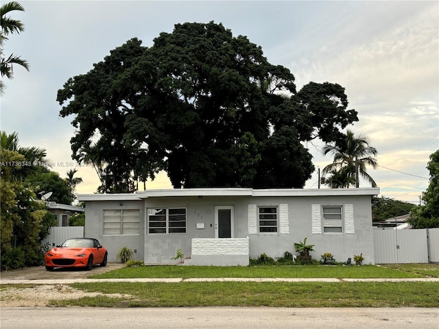 ranch-style house featuring a yard