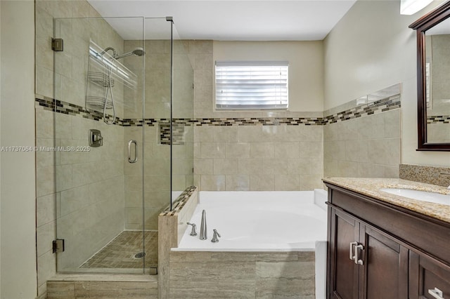 bathroom with plus walk in shower and vanity