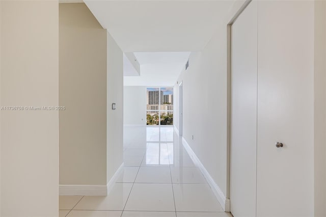 hallway featuring light tile patterned floors