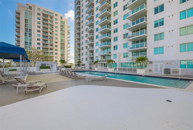 view of swimming pool with a patio