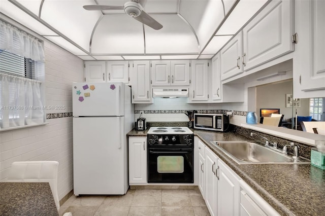 kitchen featuring light tile patterned flooring, black electric range oven, sink, white refrigerator, and white cabinets