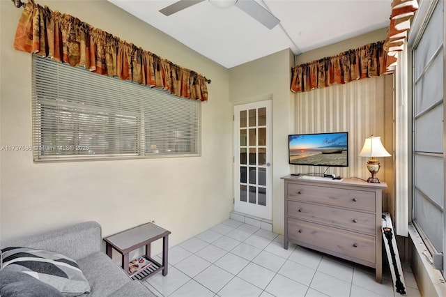 sitting room featuring light tile patterned floors and ceiling fan