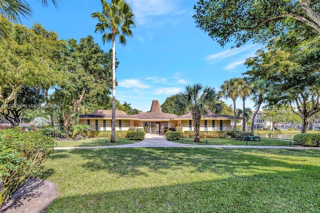 ranch-style house with a front lawn