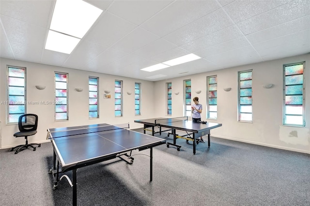 game room featuring carpet flooring and a drop ceiling