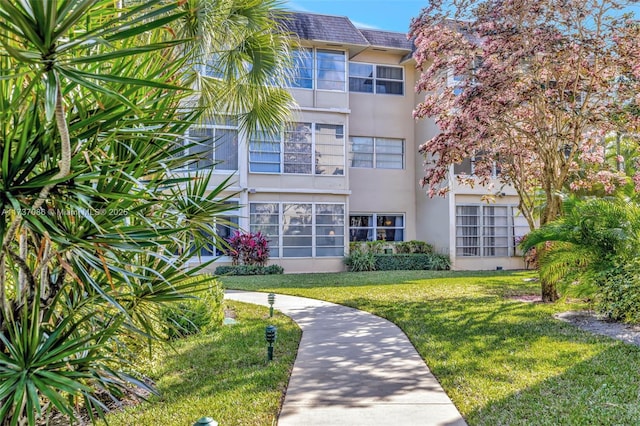 exterior space featuring a front lawn