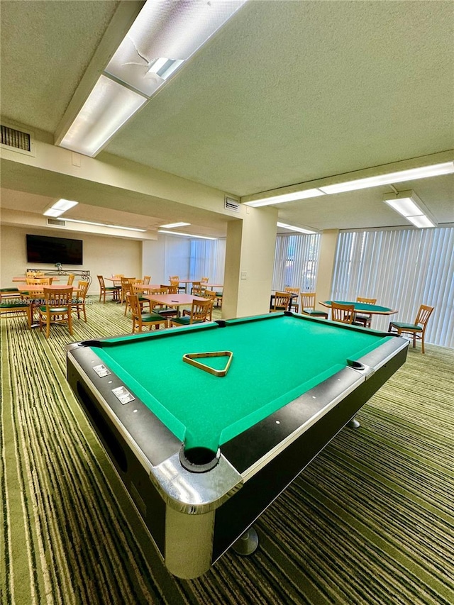 1000 Parkview Dr Unit 202, Hallandale Beach, FL 33009 - rec room with dark colored carpet, visible vents, and a textured ceiling