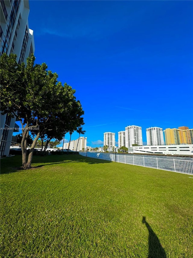 1000 Parkview Dr Unit 202, Hallandale Beach, FL 33009 - view of yard with a view of city and fence