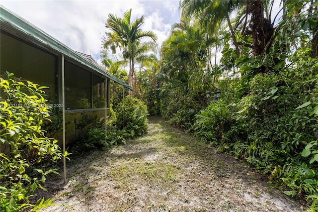 view of yard with a sunroom