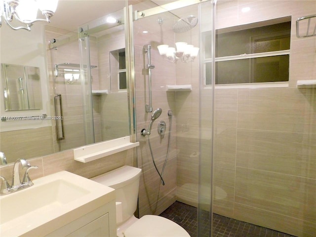 bathroom with walk in shower, vanity, toilet, and backsplash