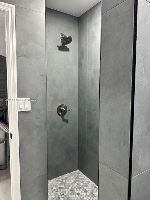 bathroom with tiled shower