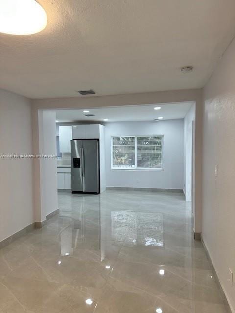 hallway featuring a textured ceiling