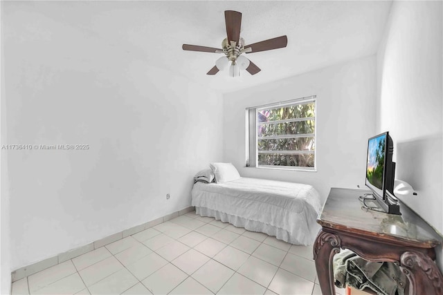 bedroom with light tile patterned floors and ceiling fan