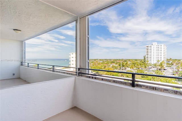 balcony featuring a water view