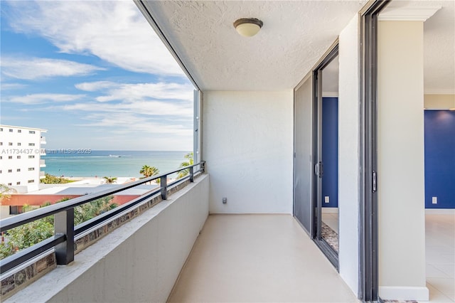 balcony featuring a water view