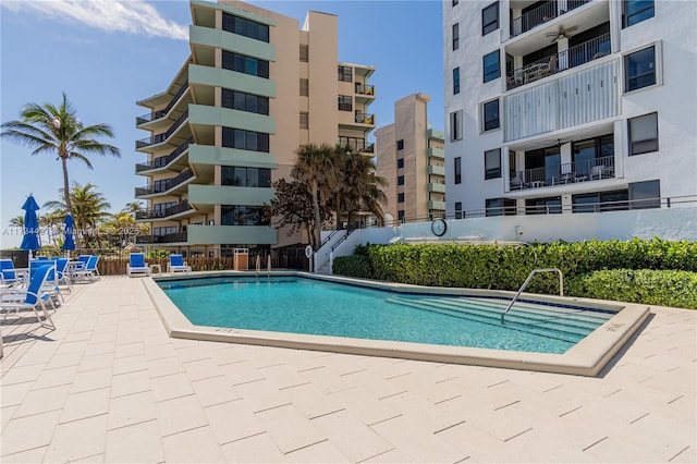 view of pool featuring a patio