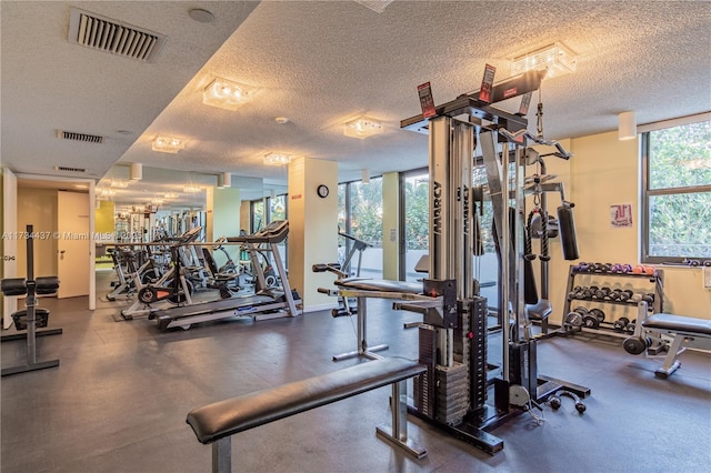 gym featuring a textured ceiling