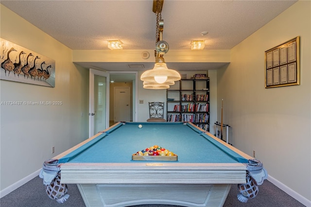 recreation room with carpet flooring and a textured ceiling