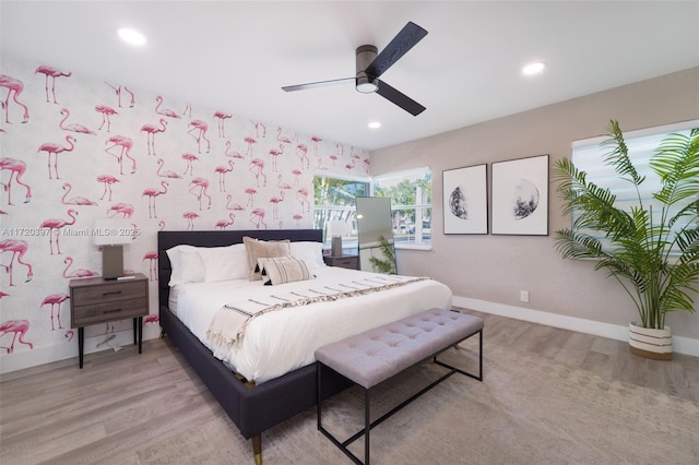 bedroom featuring ceiling fan and light hardwood / wood-style floors