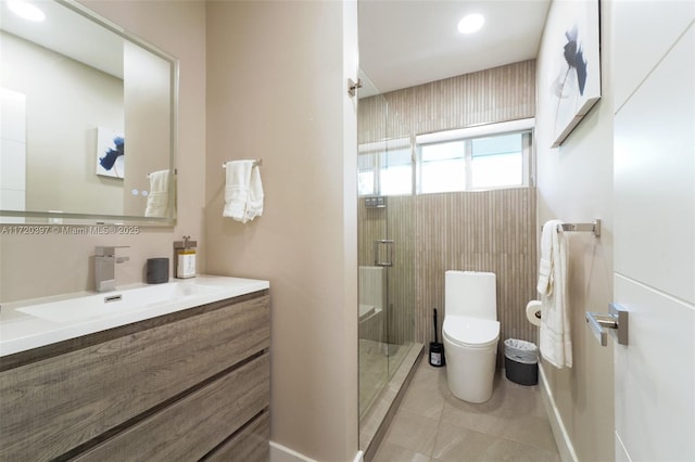 bathroom featuring tile patterned floors, vanity, toilet, and an enclosed shower