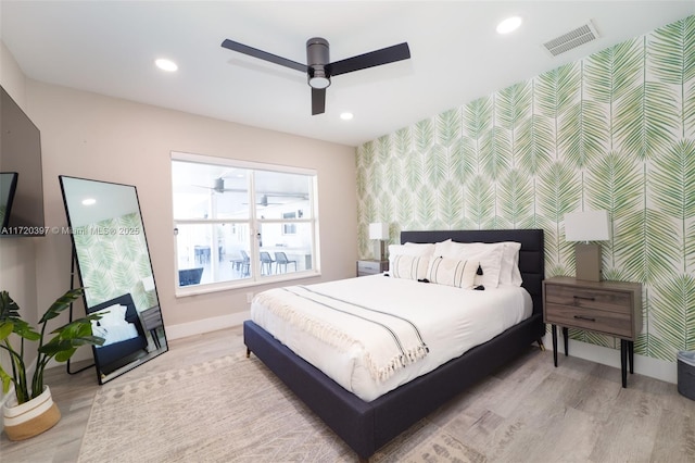 bedroom featuring ceiling fan and light hardwood / wood-style flooring