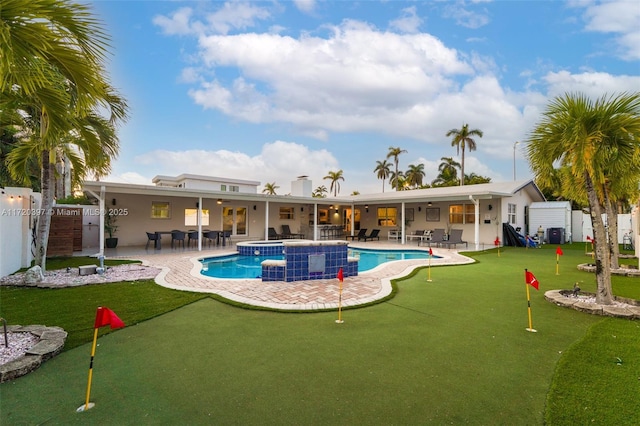 view of swimming pool featuring an in ground hot tub and a patio area