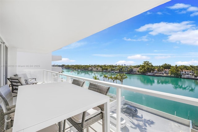 balcony featuring a water view