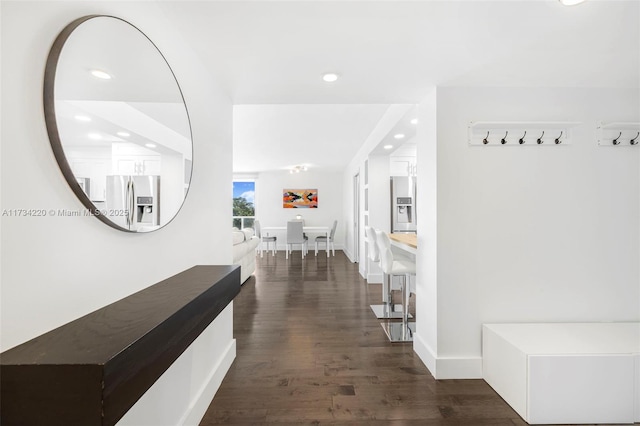 hall with dark hardwood / wood-style flooring