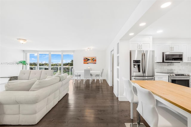 living room with dark hardwood / wood-style floors