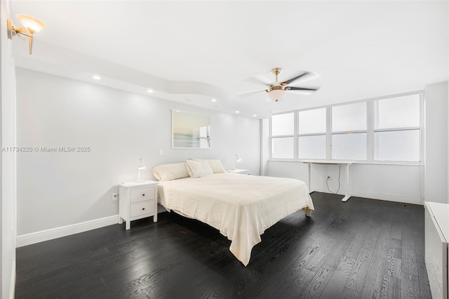 bedroom featuring dark wood-type flooring and ceiling fan