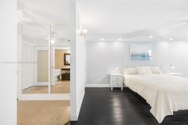 bedroom with wood-type flooring and ensuite bathroom