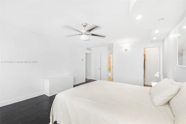 bedroom featuring dark hardwood / wood-style floors and ceiling fan