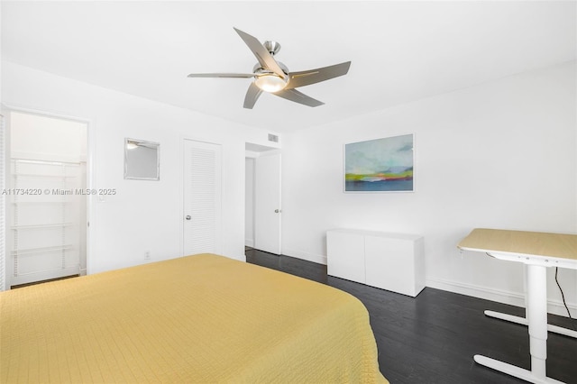 bedroom with dark wood-type flooring and ceiling fan