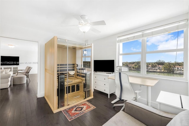 office area featuring ceiling fan and dark hardwood / wood-style flooring