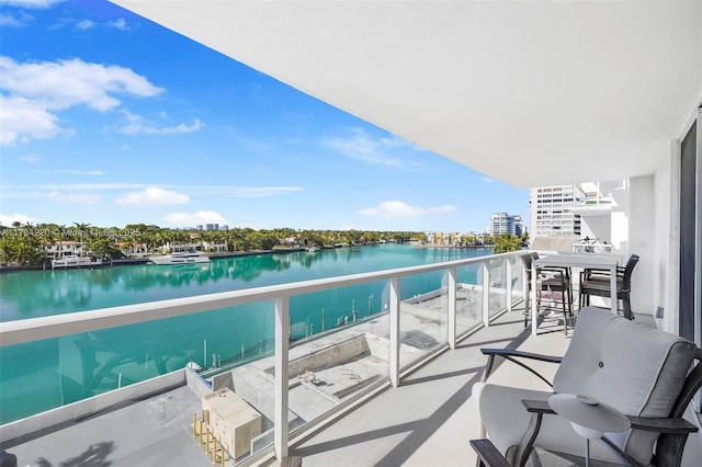 balcony featuring a water view