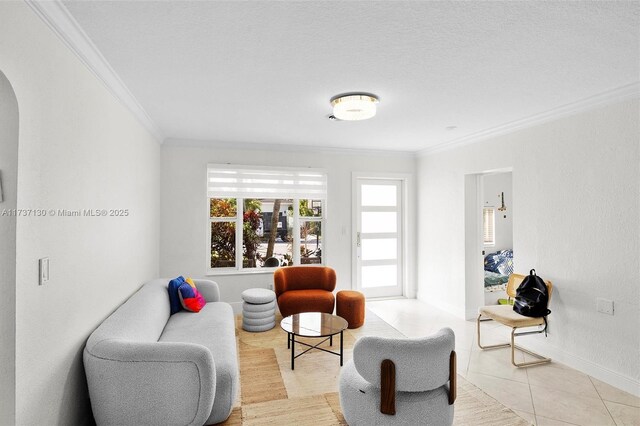 tiled living room featuring ornamental molding