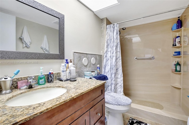 bathroom featuring vanity, a shower with curtain, and toilet