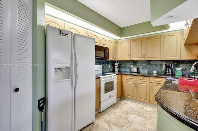 kitchen with light tile patterned flooring, light brown cabinetry, tasteful backsplash, sink, and white appliances