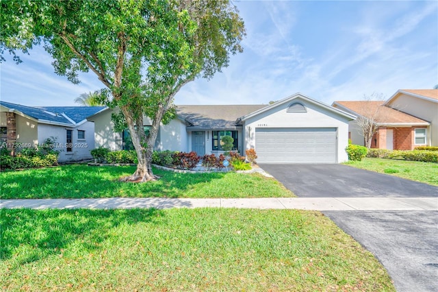 ranch-style house featuring a garage and a front yard