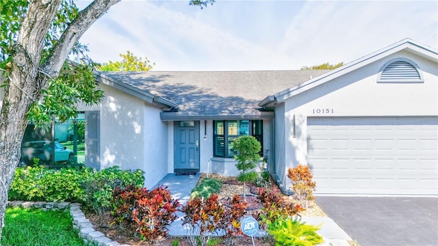 single story home featuring a garage