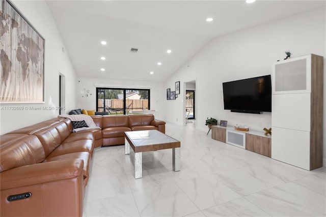 living room featuring high vaulted ceiling