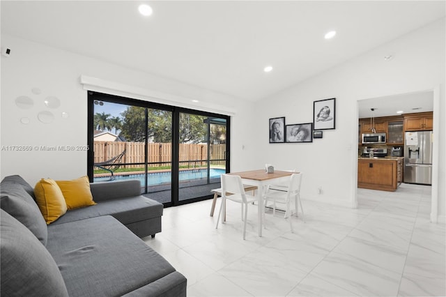 dining room featuring vaulted ceiling