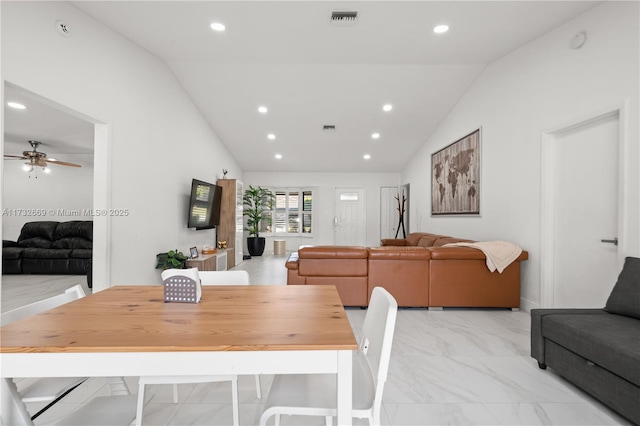 dining room with ceiling fan and vaulted ceiling