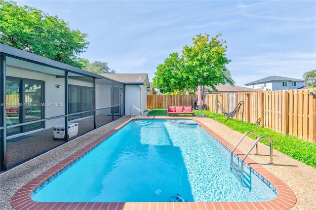 view of pool featuring a lanai and a patio area