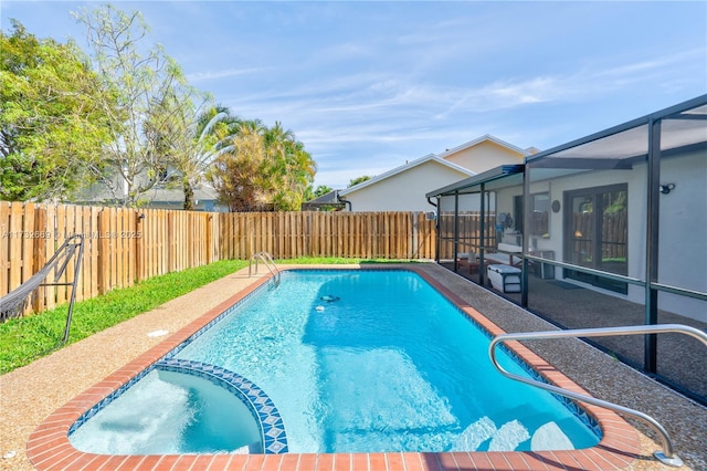 view of pool with a patio and a lanai